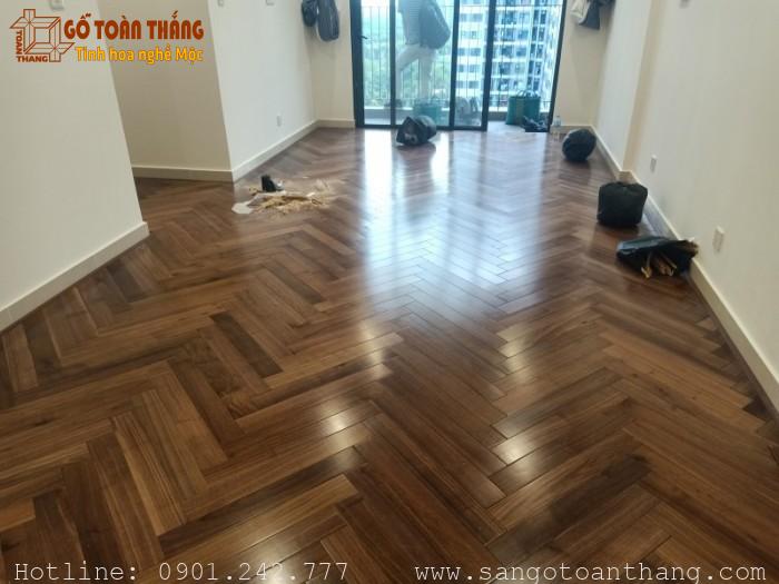 Sàn gỗ Óc Chó Xương cá 12 sàn gỗ vân bóng